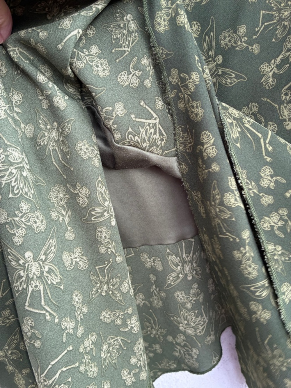 Thorn & Fable Olive Green Asymmetrical Skirt with winged skeletons & flowers - Picture 5 of 8